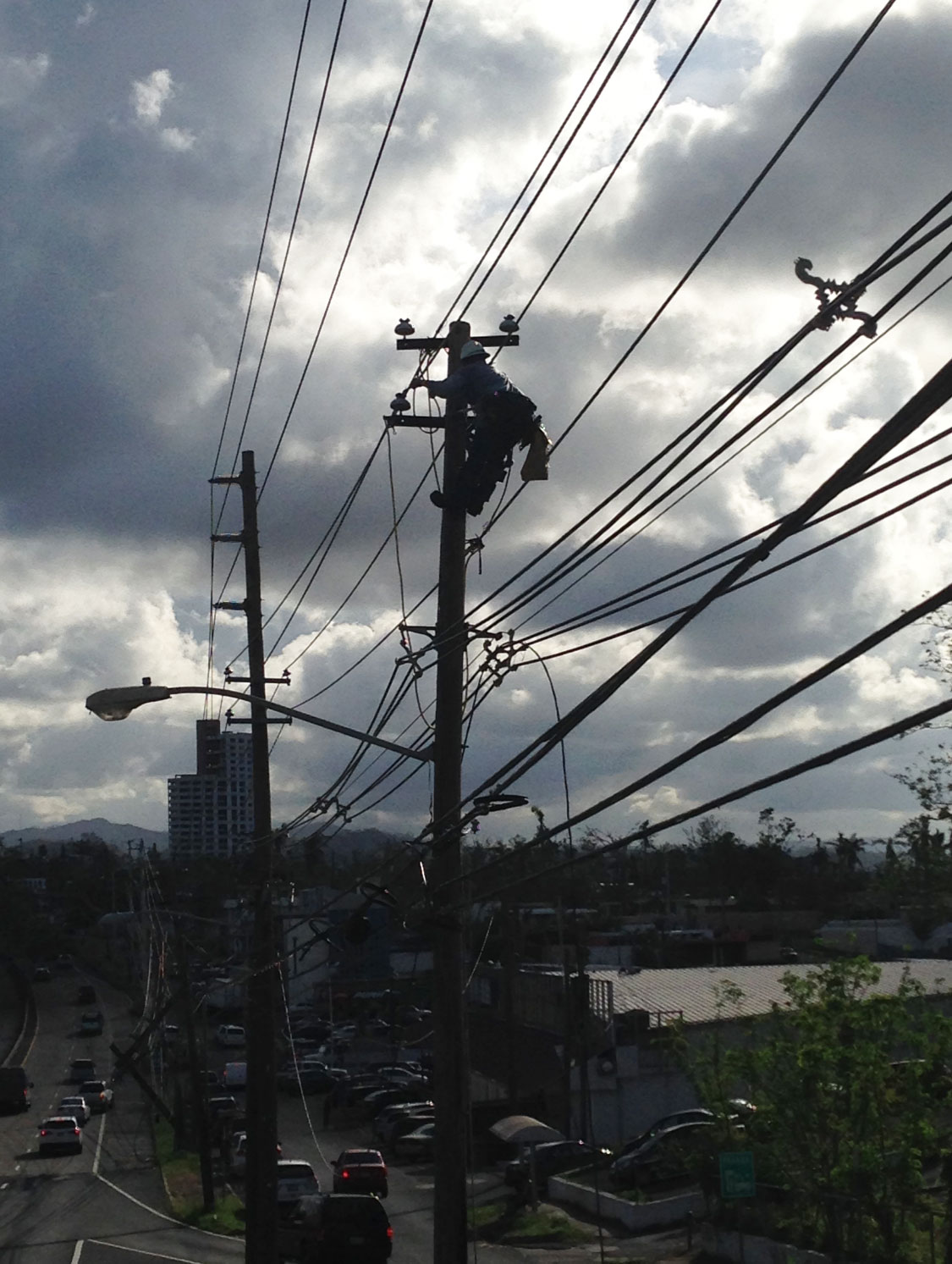 JEA Lineman in Puerto Rico climbing pole